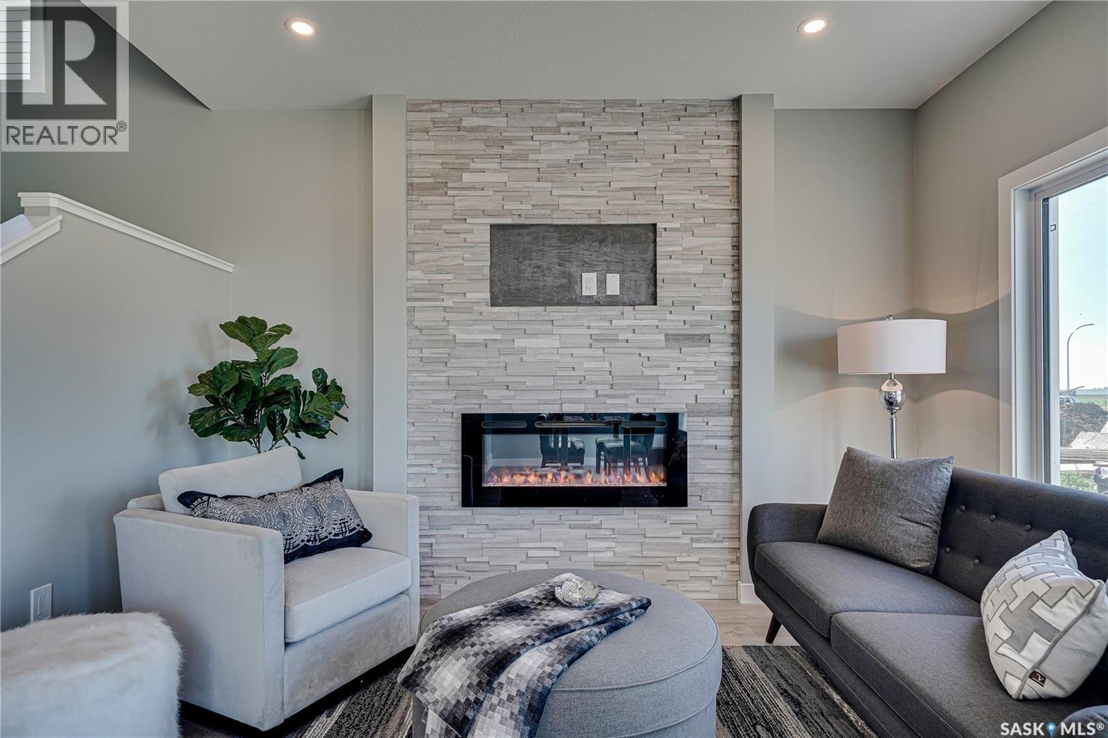 355 Asokan Bend, Saskatoon, SK - Indoor Photo Showing Living Room With Fireplace