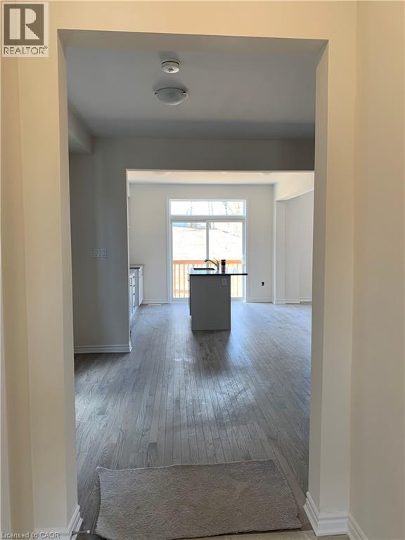 Corridor featuring baseboards and light wood-type flooring - 49 Eberhardt Drive, Wasaga Beach, ON - Indoor Photo Showing Other Room