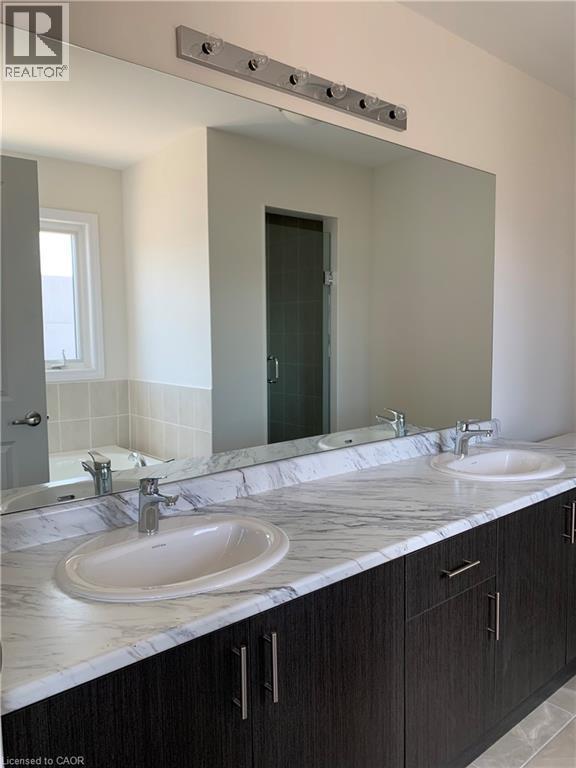 Bathroom featuring a shower stall, double vanity, and a garden tub - 49 Eberhardt Drive, Wasaga Beach, ON - Indoor Photo Showing Bathroom