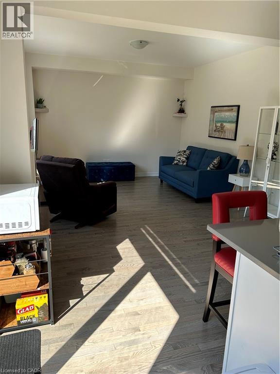 Living area featuring wood finished floors - 49 Eberhardt Drive, Wasaga Beach, ON - Indoor