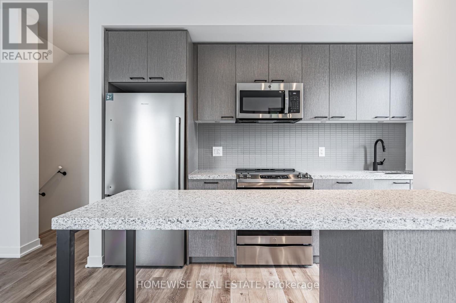 Th8 - 20 Ed Clark Gardens, Toronto, ON - Indoor Photo Showing Kitchen With Stainless Steel Kitchen With Upgraded Kitchen