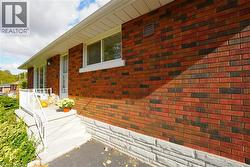 View of side of property with brick siding -