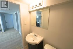 Bathroom featuring vanity and washer / dryer -