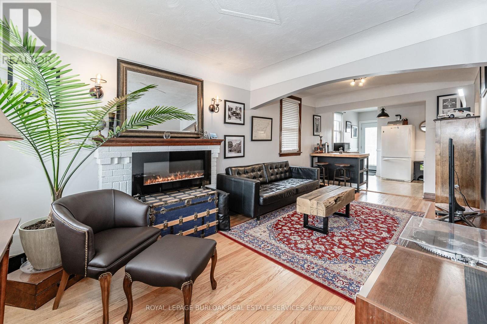131 Adeline Avenue, Hamilton, ON - Indoor Photo Showing Living Room With Fireplace