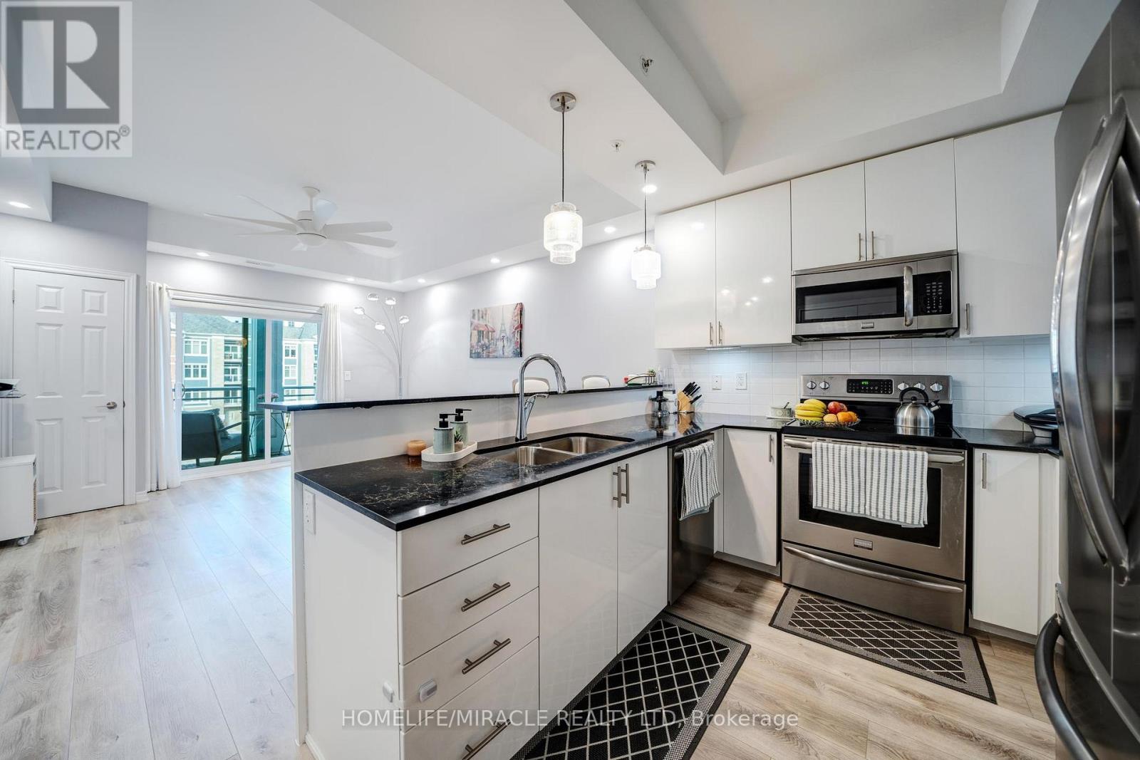 303 - 650 Gordon Street, Whitby, ON - Indoor Photo Showing Kitchen With Stainless Steel Kitchen With Double Sink With Upgraded Kitchen