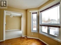 Spare room with light wood-style flooring and ceiling fan -