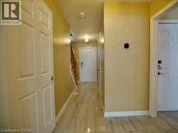 Corridor with stairs and a textured ceiling -