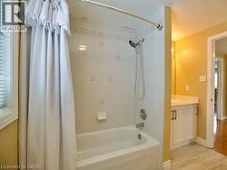Full bathroom with shower / tub combo and vanity -