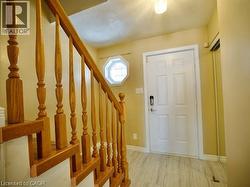 Entryway with stairs and baseboards -
