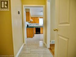 Corridor featuring baseboards -