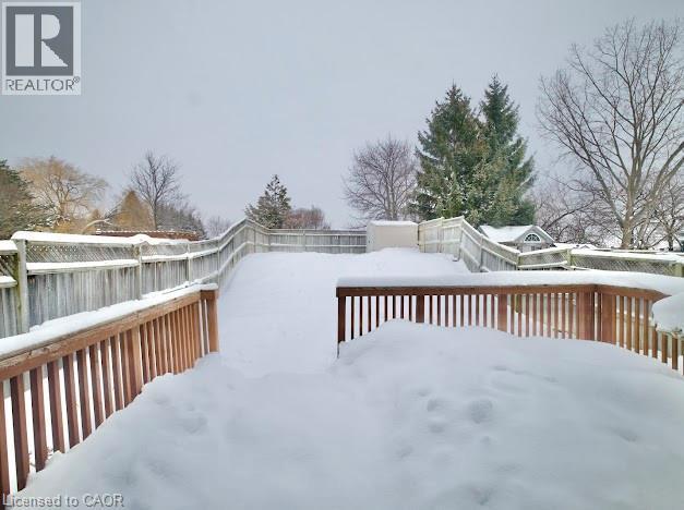 Snow covered deck featuring a fenced backyard - 109 Beechmanor Crescent, Kitchener, ON - Outdoor With Deck Patio Veranda