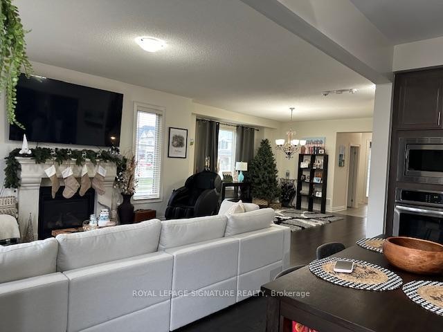 1317 Raspberry Terrace, Milton, ON - Indoor Photo Showing Living Room With Fireplace