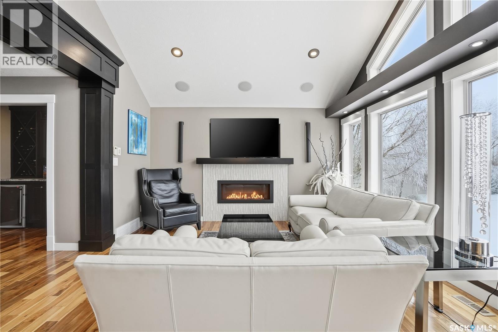 4818 Sandpiper Crescent E, Regina, SK - Indoor Photo Showing Living Room With Fireplace