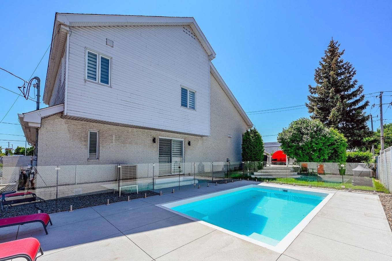 Backyard - 8990 Place Rodier, Brossard, QC - Outdoor With In Ground Pool With Deck Patio Veranda With Exterior
