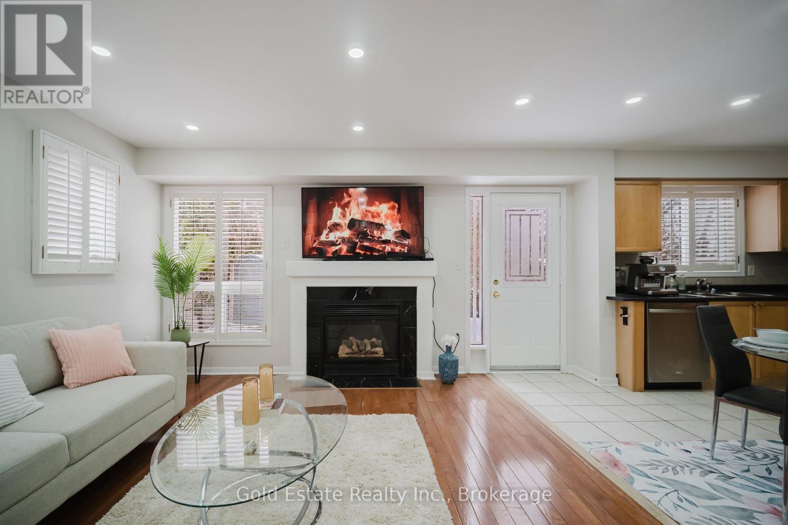 1627 Samuelson Circle, Mississauga, ON - Indoor Photo Showing Living Room With Fireplace
