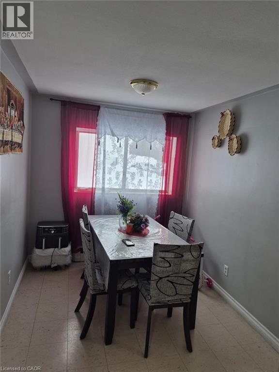 Dining space with plenty of natural light - 76 Brybeck Crescent Unit# 204, Kitchener, ON - Indoor Photo Showing Dining Room