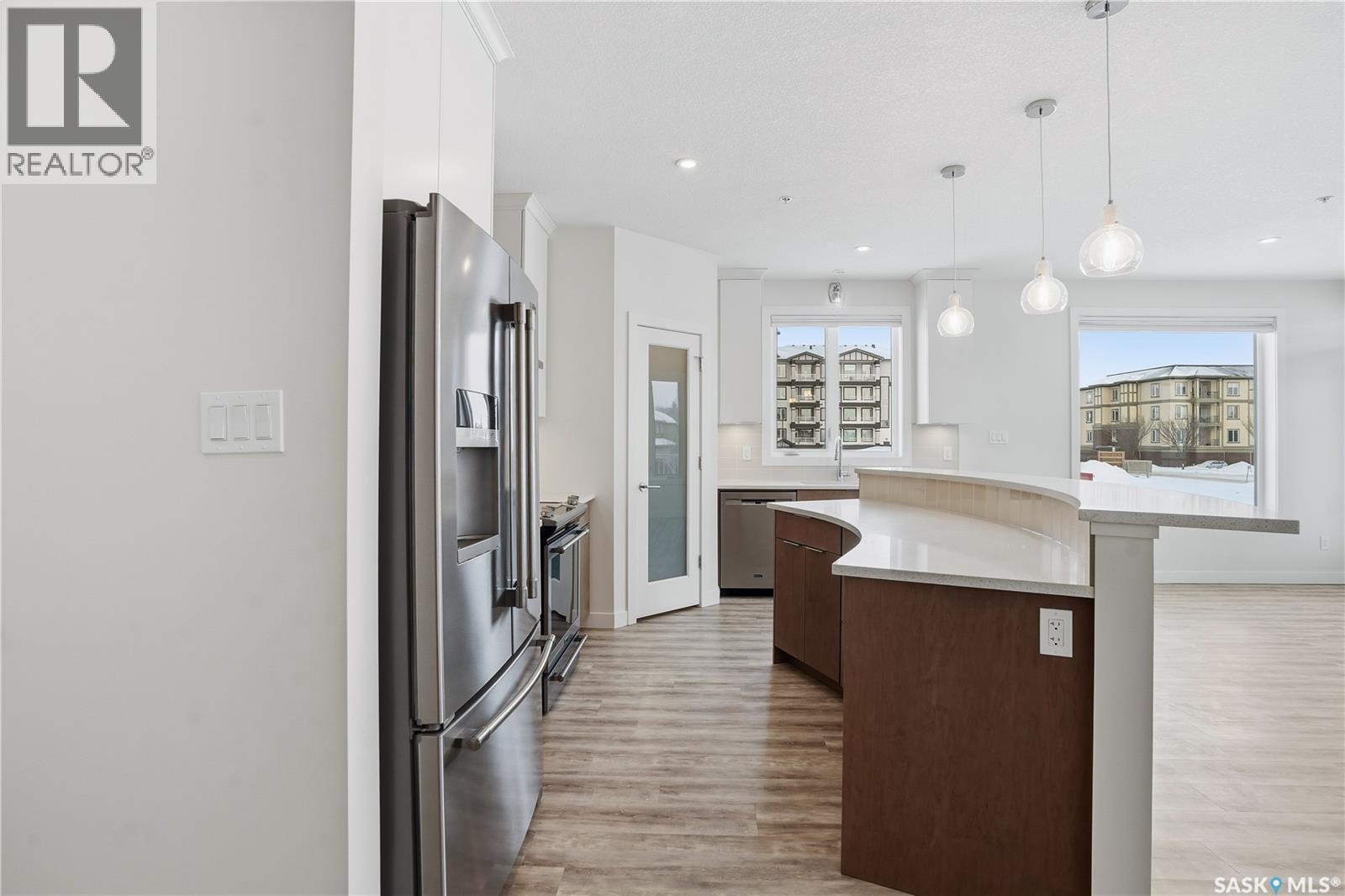 201 3581 Evans Court, Regina, SK - Indoor Photo Showing Kitchen With Upgraded Kitchen