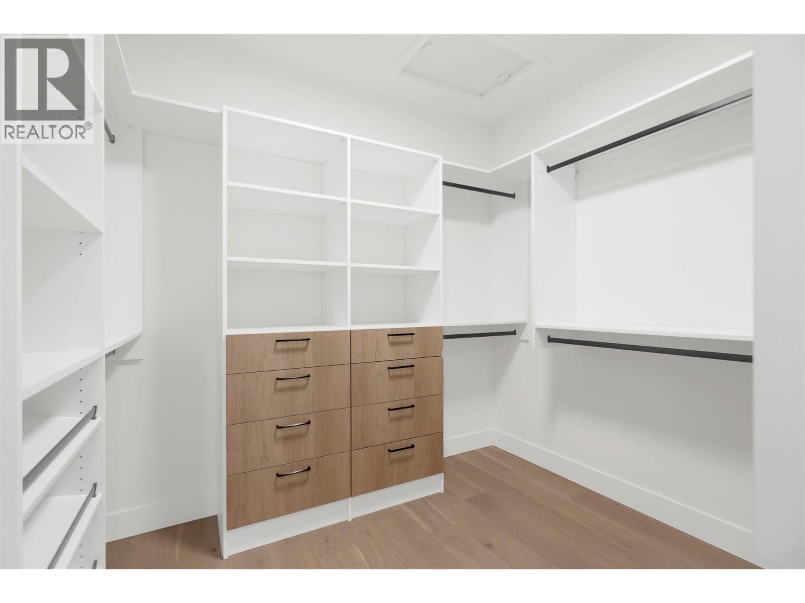 Large master bedroom walk in closet - 5533 Foothill Court, Kelowna, BC - Indoor With Storage