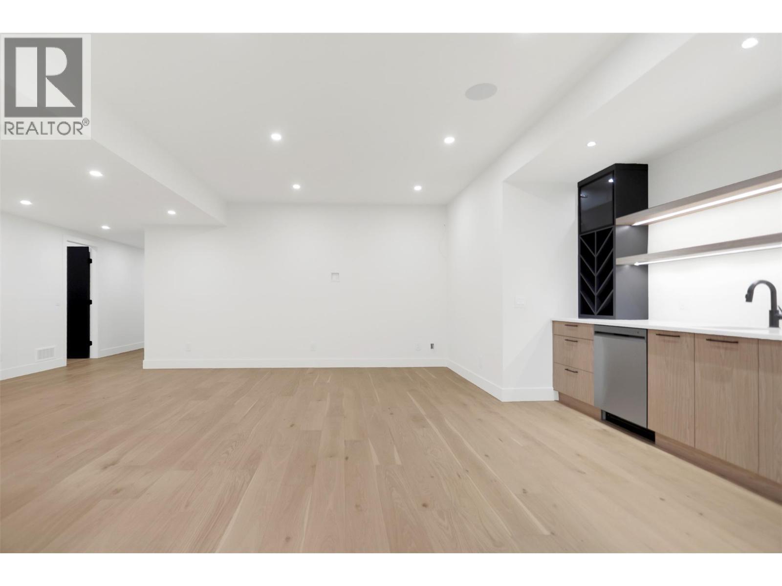 An entertainer's dream with space for a TV area and room for a pool table - ideal for family fun - 5533 Foothill Court, Kelowna, BC - Indoor