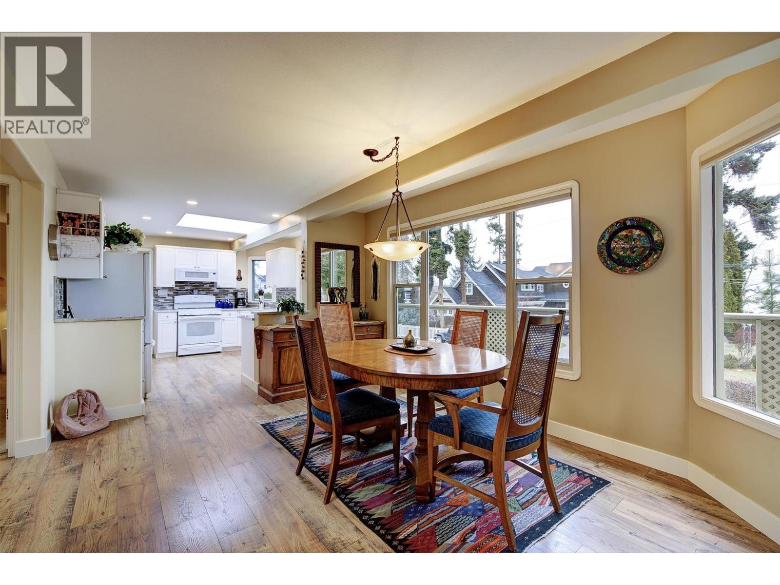 Dining room with partial lake views! - 391 Braeloch Road, Kelowna, BC - Indoor Photo Showing Dining Room