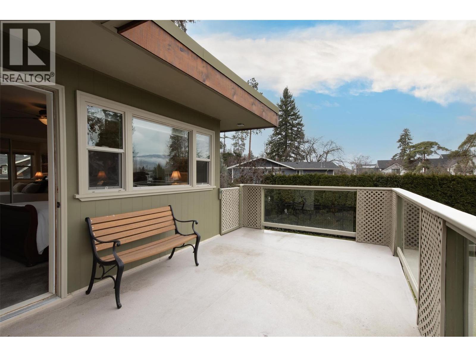 Enjoy quiet mornings on your front patio - 391 Braeloch Road, Kelowna, BC - Outdoor With Exterior