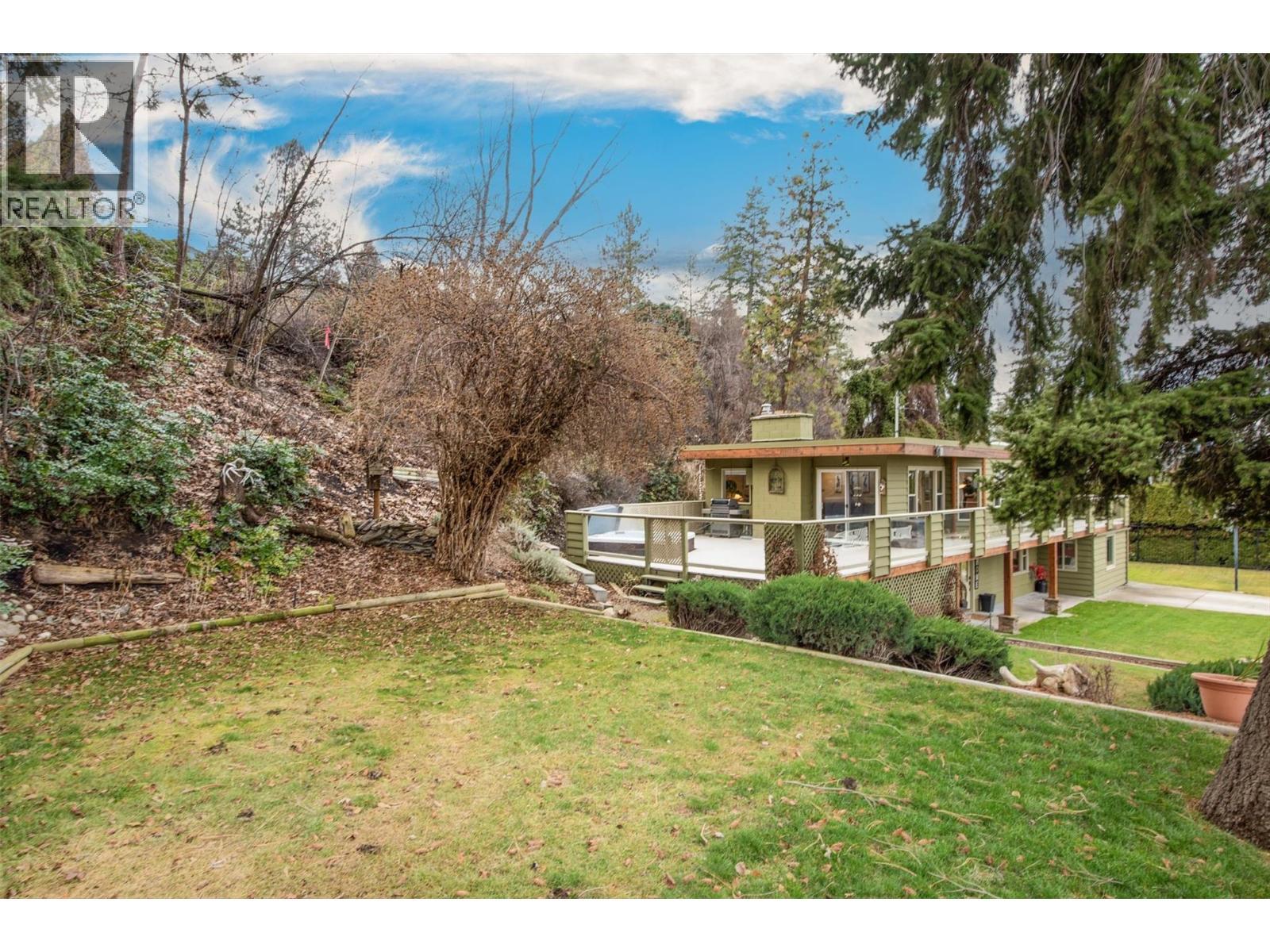 Upper yard features raised garden beds and easy care perennial plants - 391 Braeloch Road, Kelowna, BC - Outdoor