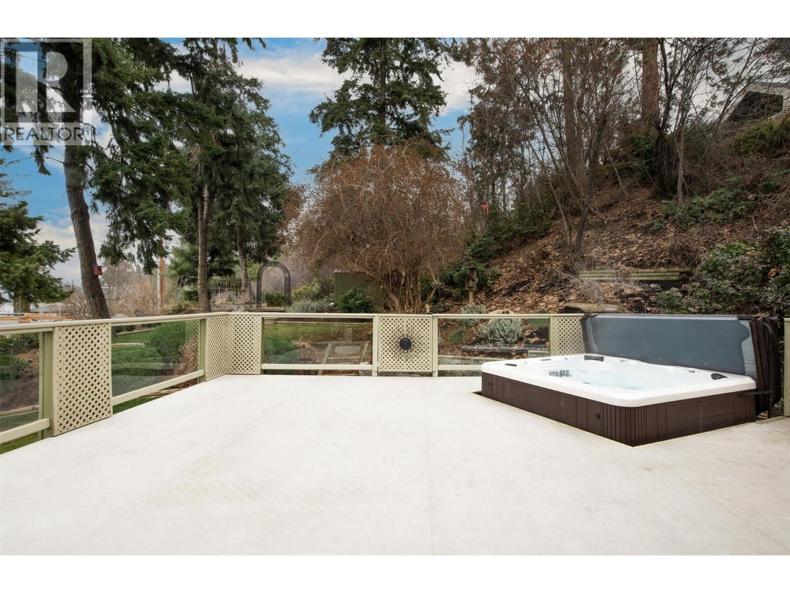 Wet zone 2012 hot tub on large 1100 sqft patio - 391 Braeloch Road, Kelowna, BC - Outdoor