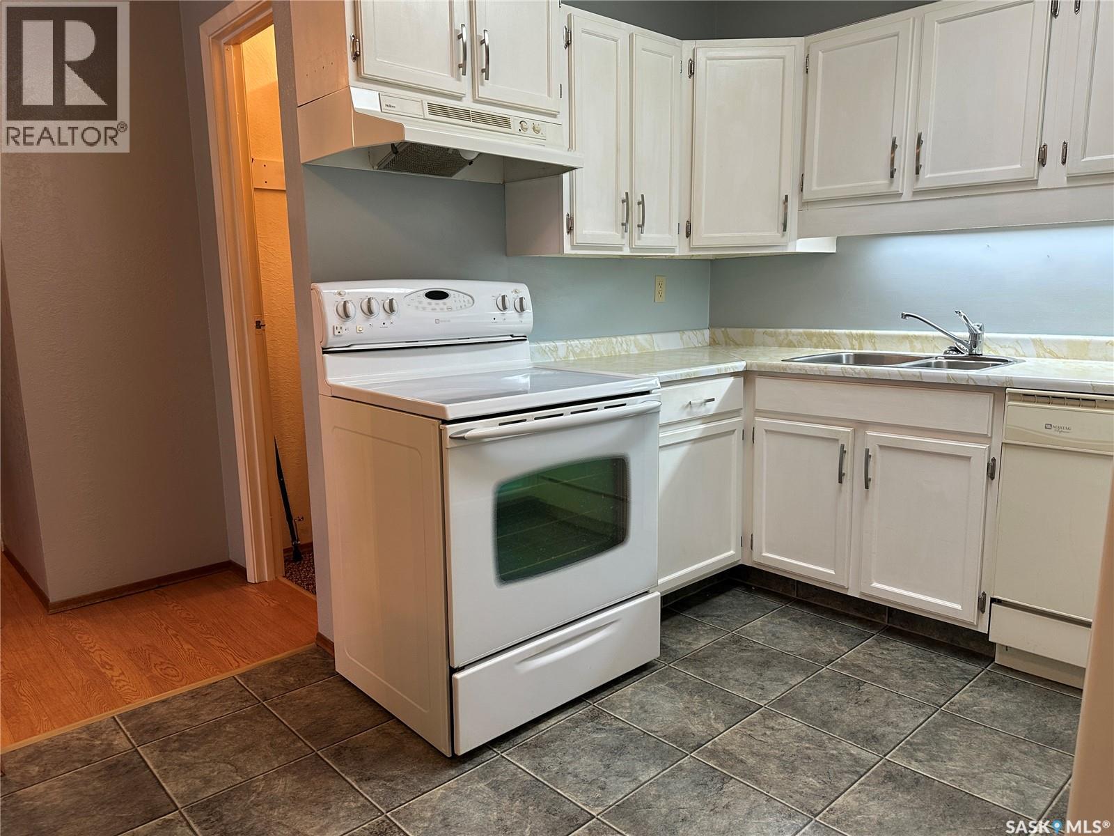 11 228 3Rd Street, Weyburn, SK - Indoor Photo Showing Kitchen With Double Sink