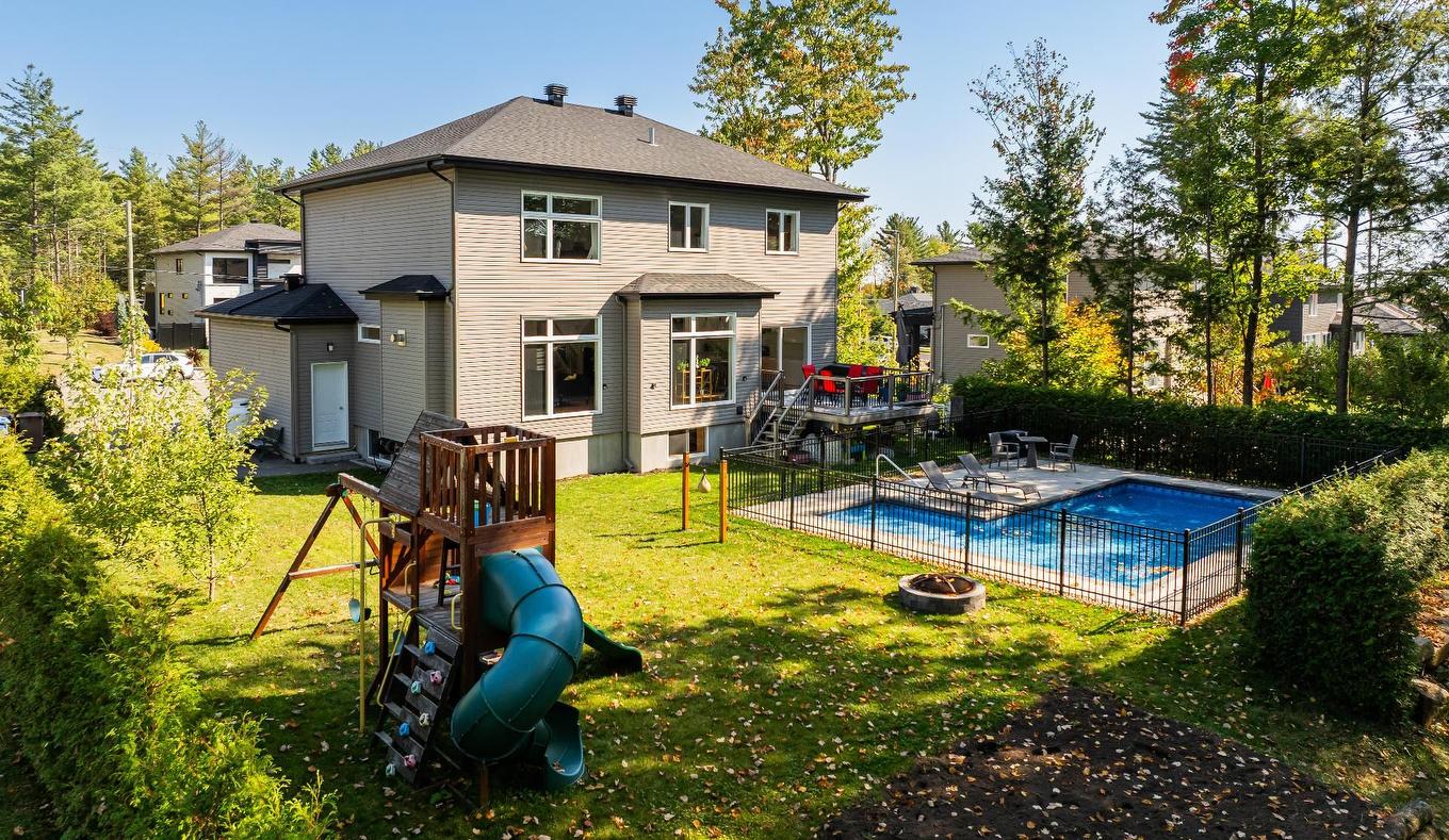Cour - 16940 Rue Du Zircon, Mirabel, QC - Outdoor With In Ground Pool With Backyard