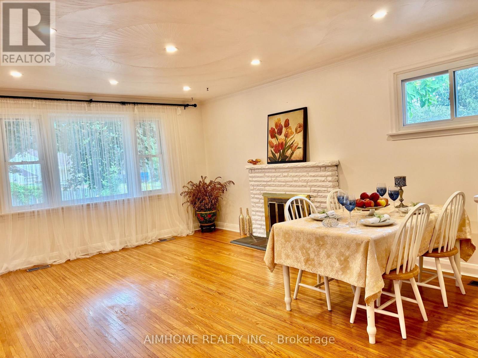 12 Canham Crescent, Toronto, ON - Indoor Photo Showing Dining Room With Fireplace
