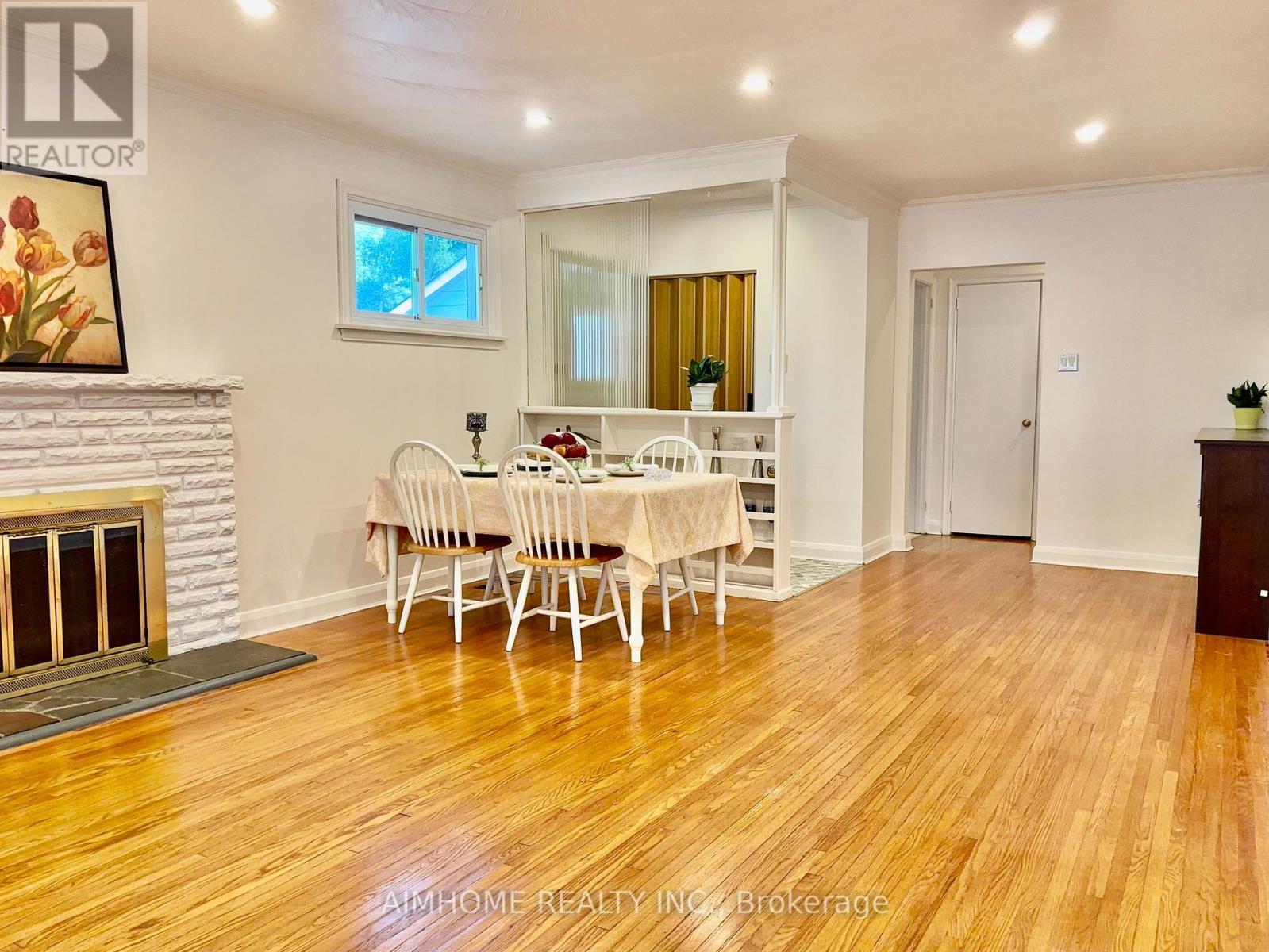12 Canham Crescent, Toronto, ON - Indoor Photo Showing Dining Room With Fireplace