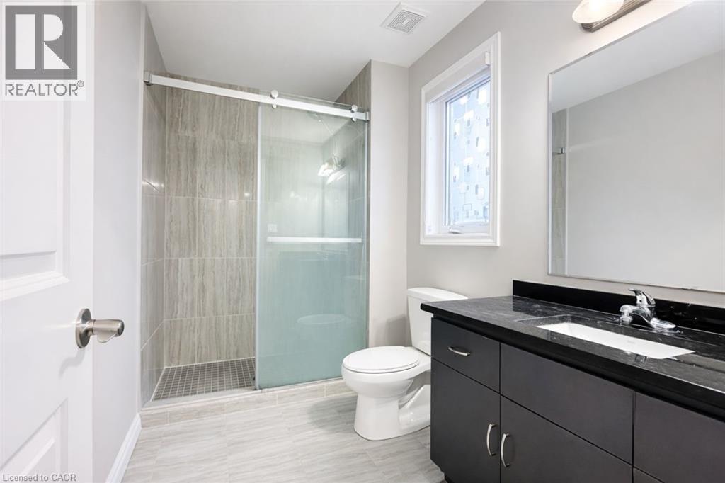 Full bath with a stall shower and vanity - 127 Elmbank Trail Unit# Upper, Kitchener, ON - Indoor Photo Showing Bathroom