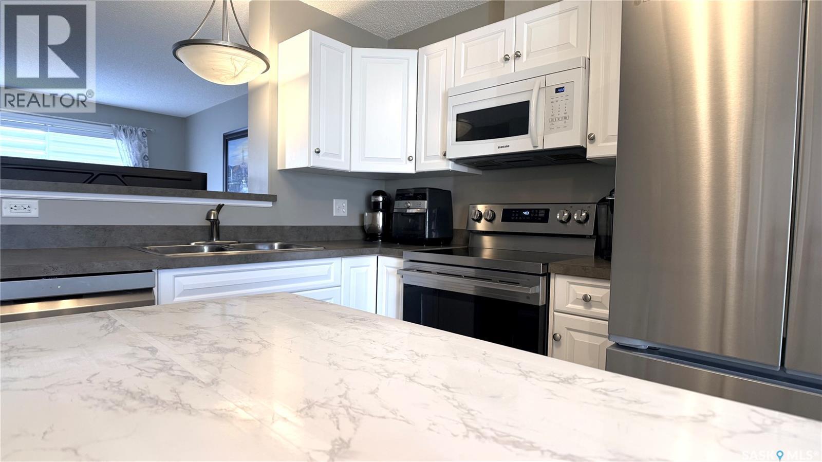 2 1621 First Street, Estevan, SK - Indoor Photo Showing Kitchen With Double Sink