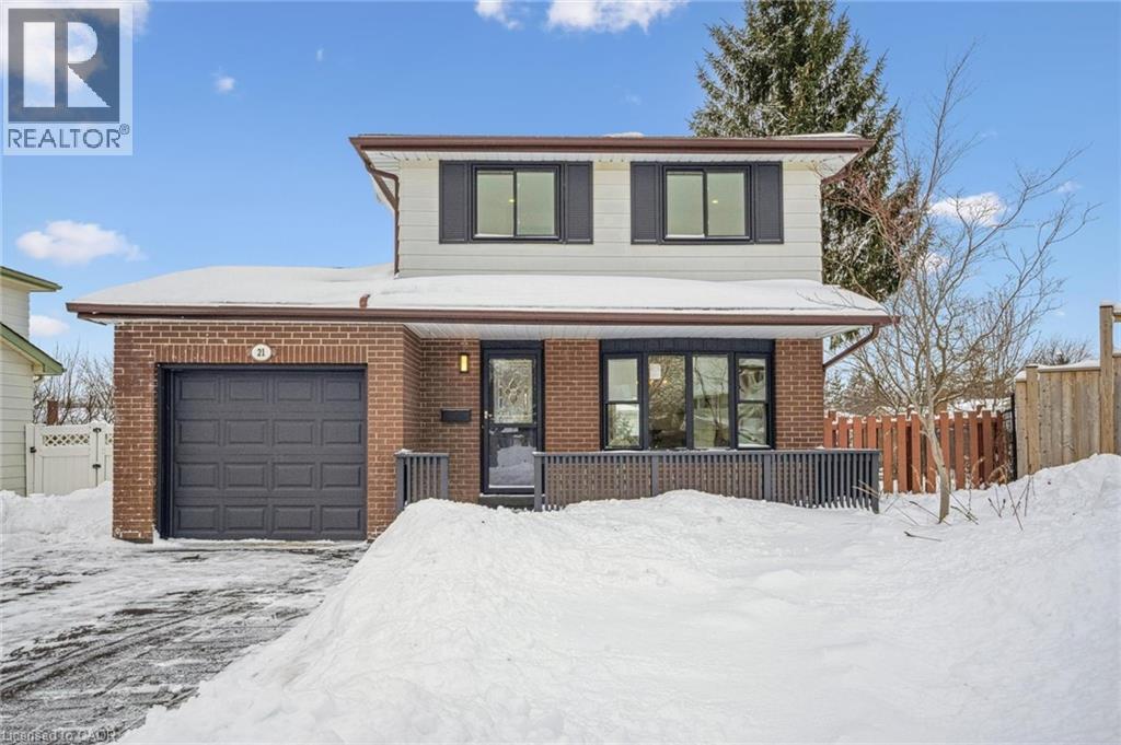 Traditional home featuring an attached garage and brick siding - 21 Forest Glen Court, Kitchener, ON - Outdoor