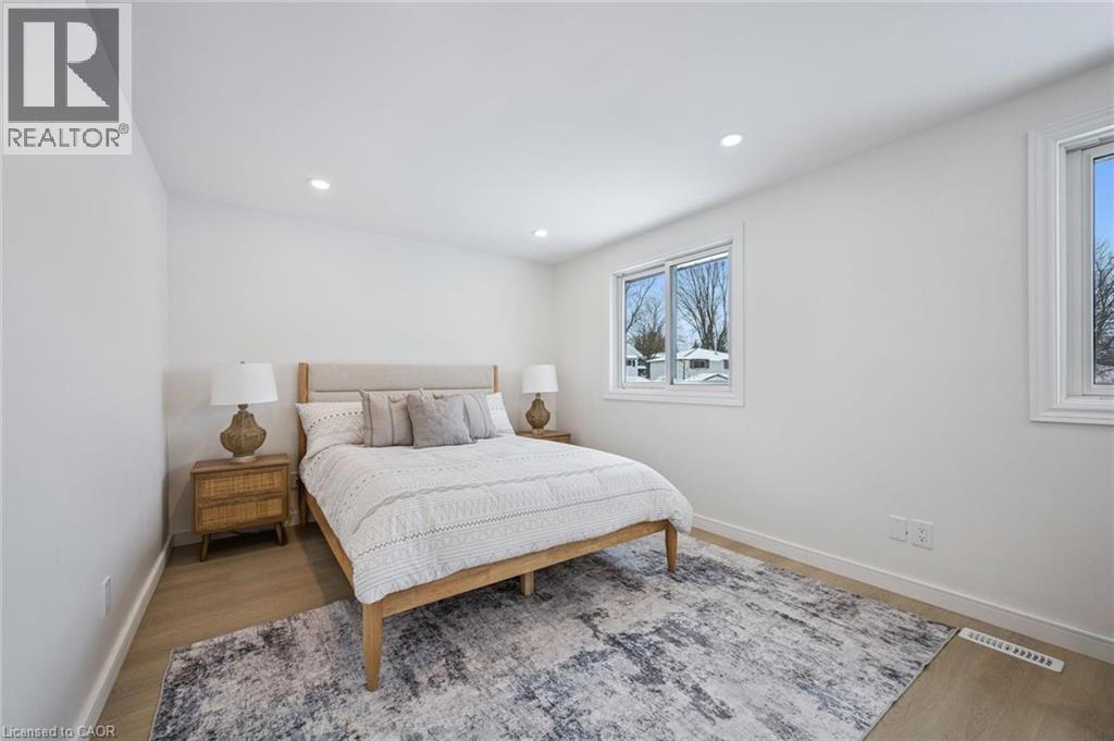 Bedroom with wood finished floors and recessed lighting - 21 Forest Glen Court, Kitchener, ON - Indoor Photo Showing Bedroom