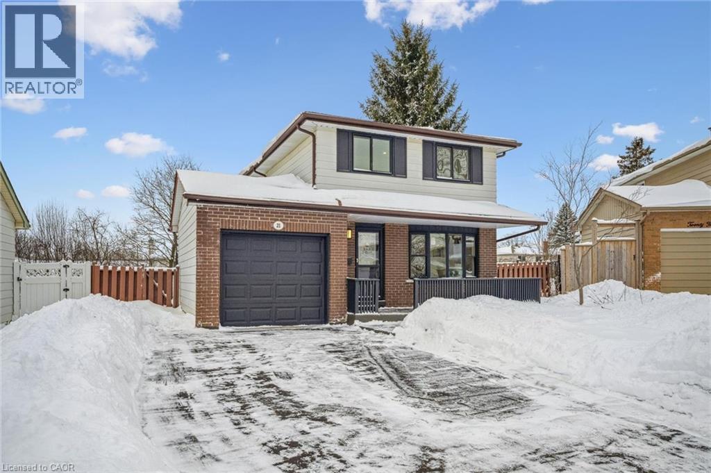 Traditional-style house featuring brick siding, a porch, and an attached garage - 21 Forest Glen Court, Kitchener, ON - Outdoor