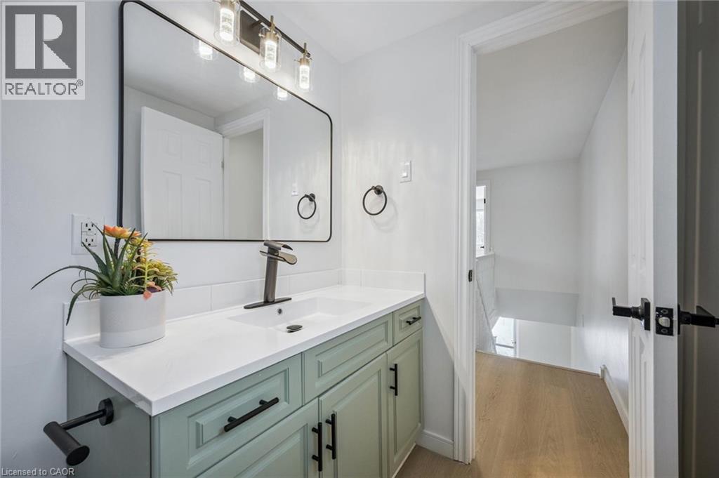 Bathroom with vanity and light wood-type flooring - 21 Forest Glen Court, Kitchener, ON - Indoor Photo Showing Bathroom