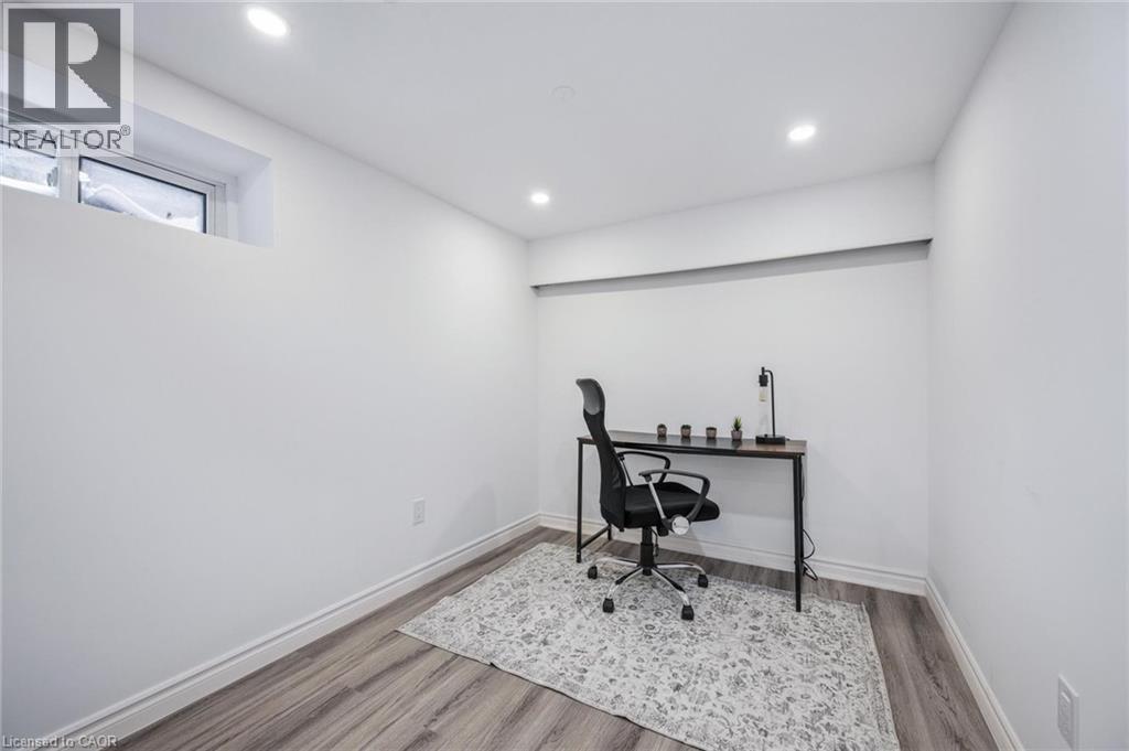 Office space featuring wood finished floors and recessed lighting - 21 Forest Glen Court, Kitchener, ON - Indoor Photo Showing Other Room