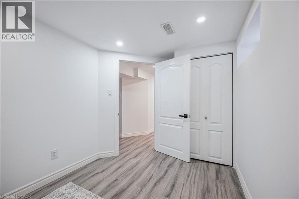 Unfurnished bedroom featuring light wood finished floors, a closet, and recessed lighting - 21 Forest Glen Court, Kitchener, ON - Indoor Photo Showing Other Room