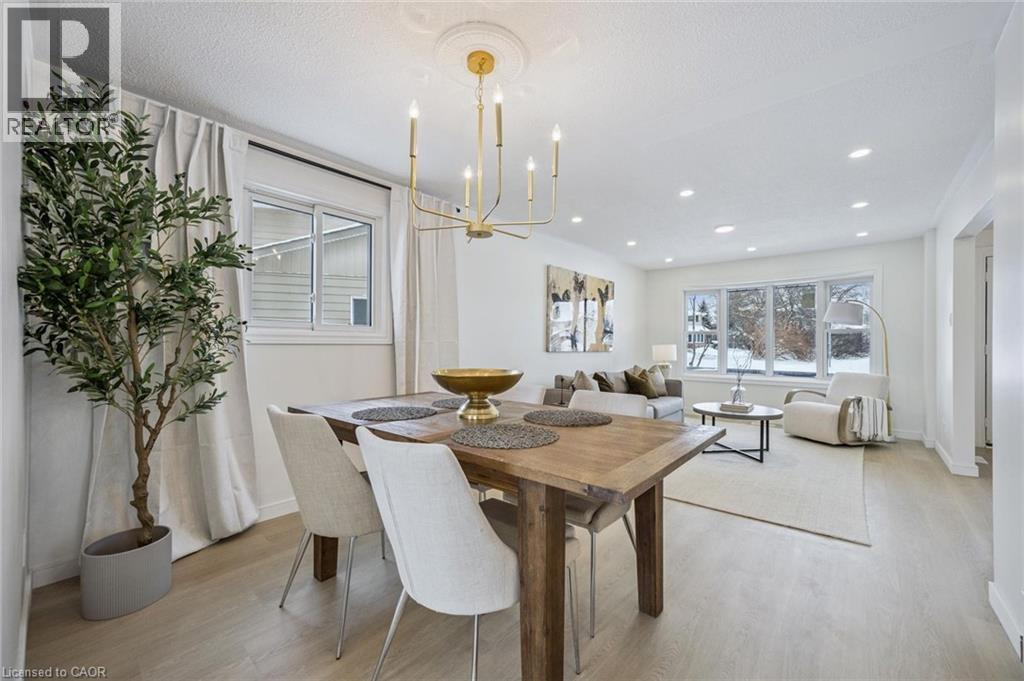 Dining area featuring light wood finished floors, a chandelier, and recessed lighting - 21 Forest Glen Court, Kitchener, ON - Indoor Photo Showing Other Room