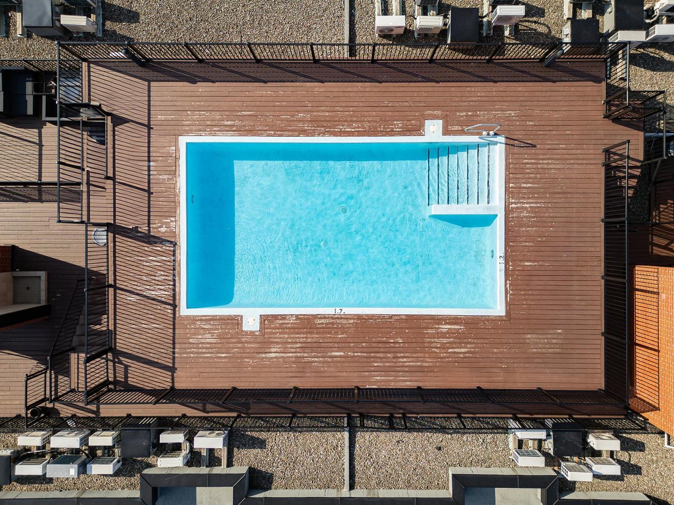 Piscine - 408-4700 Boul. Henri-Bourassa O., Montréal (Saint-Laurent), QC - Outdoor With In Ground Pool With Exterior