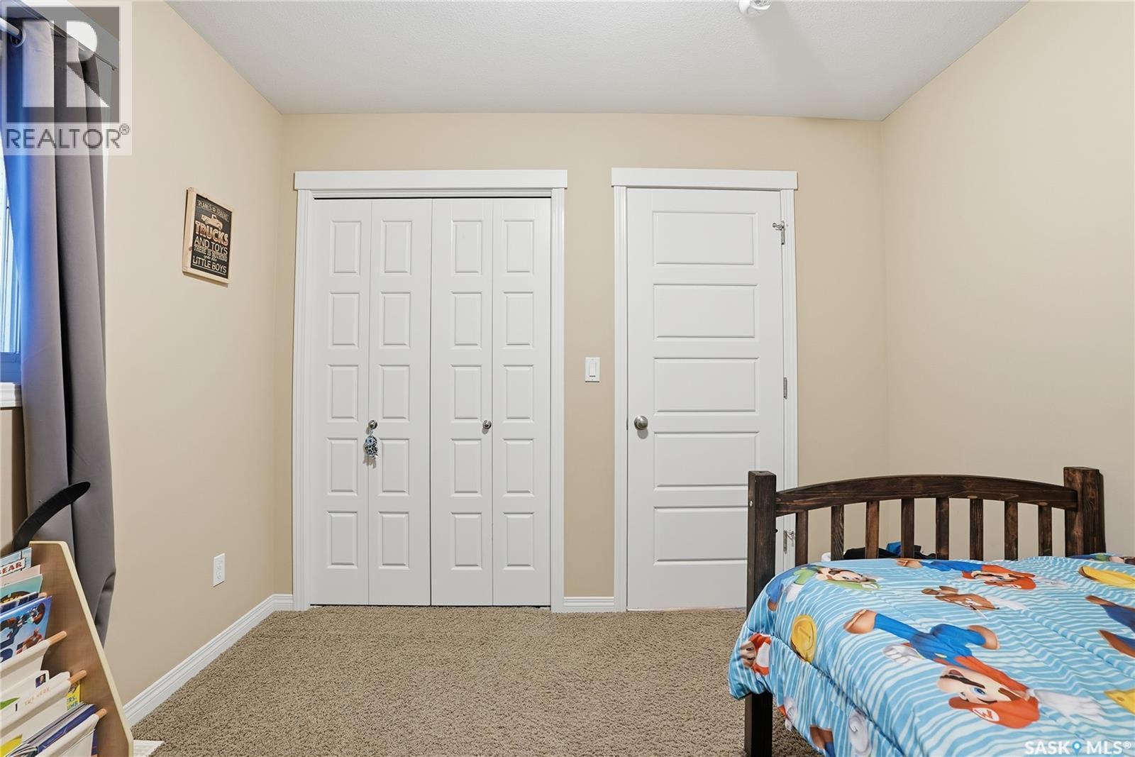 219 Henick Crescent, Saskatoon, SK - Indoor Photo Showing Bedroom