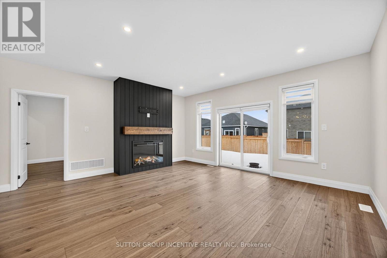 123 Ritchie Crescent, Springwater, ON - Indoor Photo Showing Other Room With Fireplace