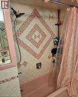 Full bathroom featuring shower / bath combination with curtain -