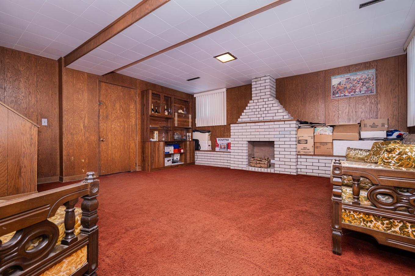 Family room - 1404 Boul. Élisabeth, Laval (Chomedey), QC - Indoor Photo Showing Other Room With Fireplace