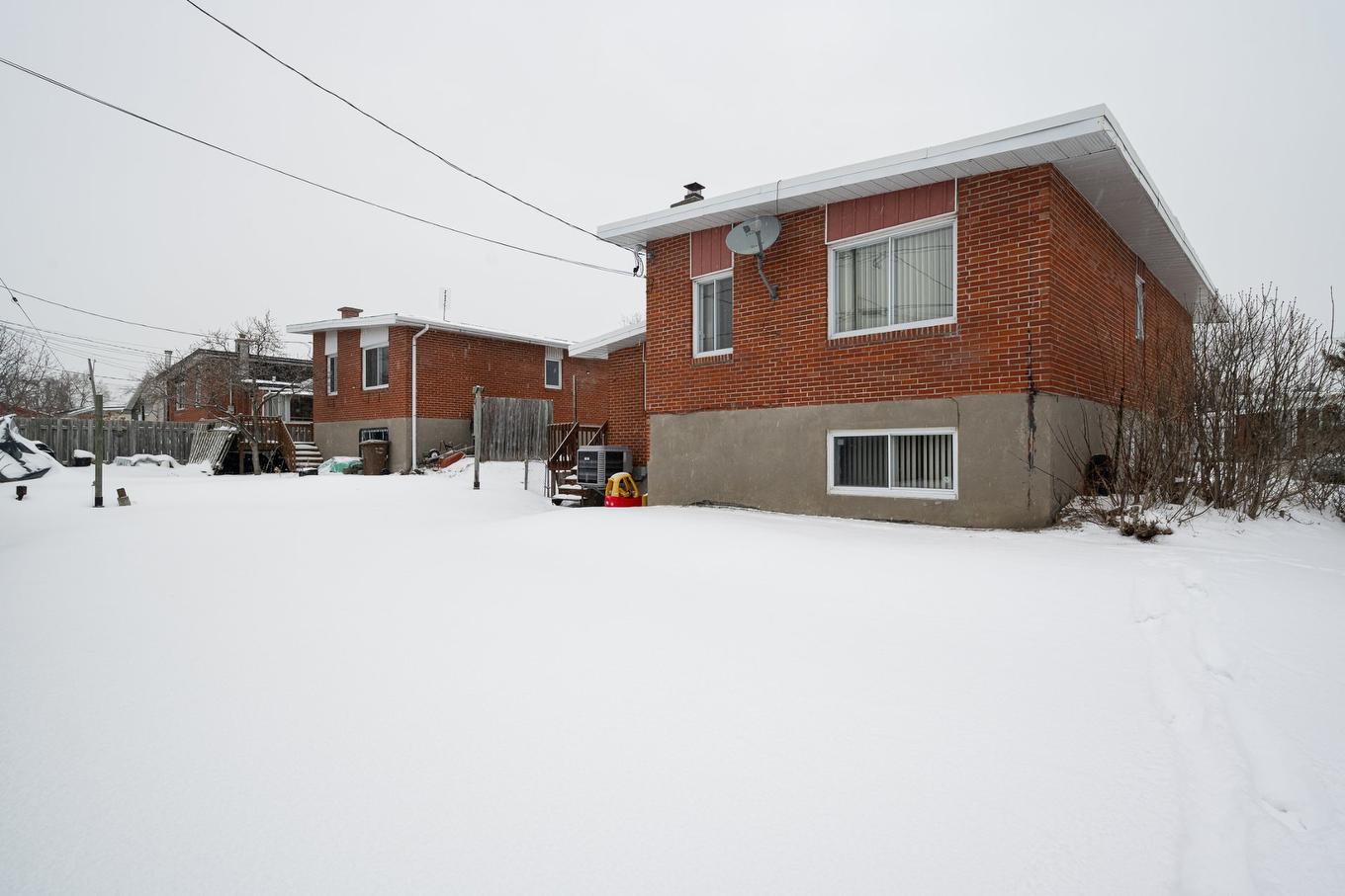 Back facade - 1404 Boul. Élisabeth, Laval (Chomedey), QC - Outdoor With Exterior