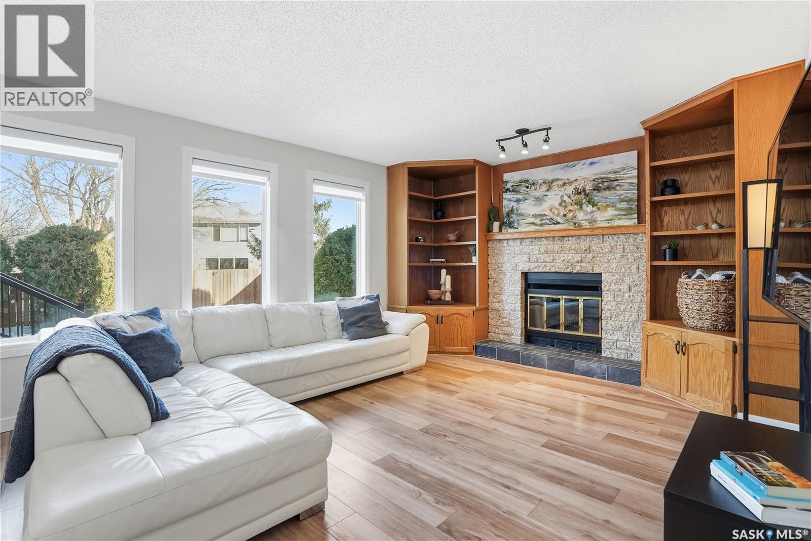 215 Wickenden Crescent, Saskatoon, SK - Indoor Photo Showing Living Room With Fireplace