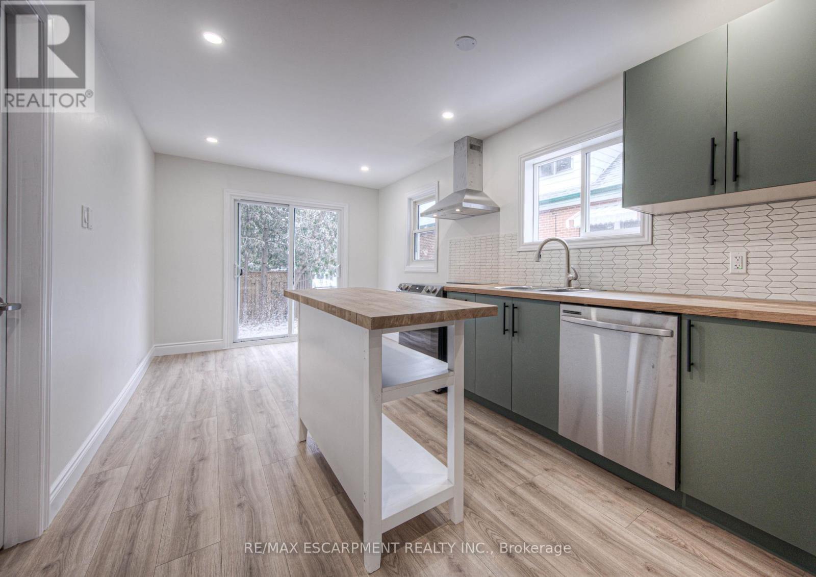 sliding doors to backyard - 30 Young Street W, Waterloo, ON - Indoor Photo Showing Kitchen With Upgraded Kitchen