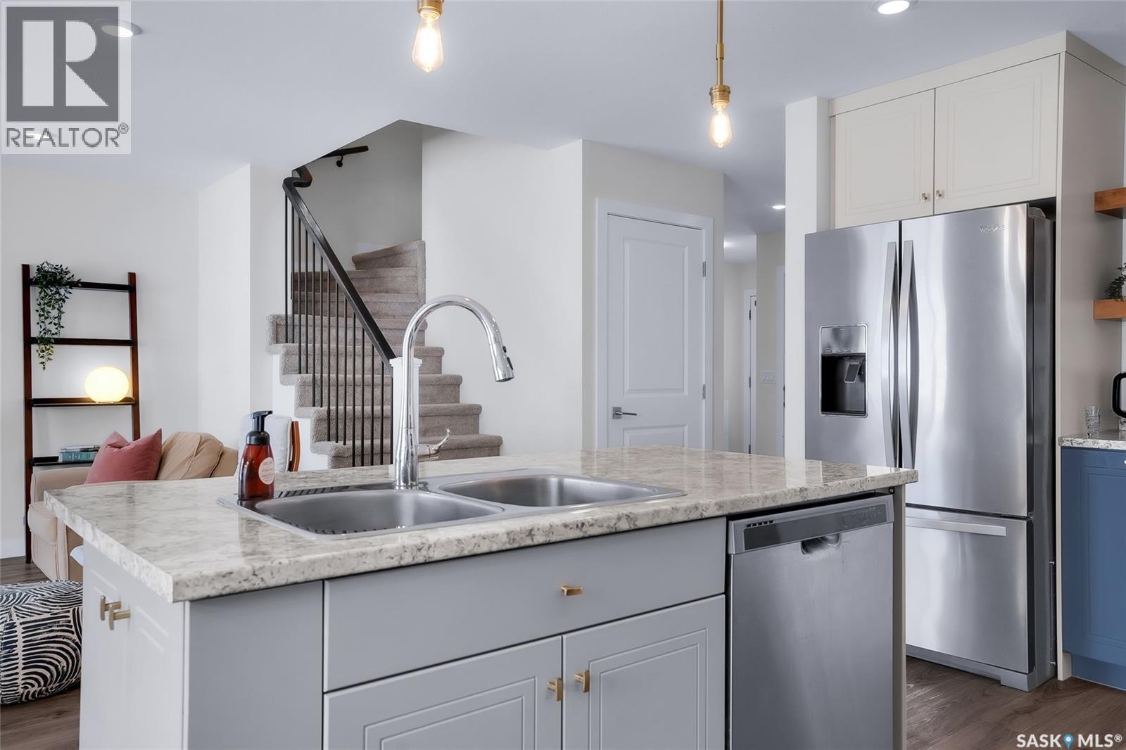 1059 Kolynchuk Crescent, Saskatoon, SK - Indoor Photo Showing Kitchen With Stainless Steel Kitchen With Double Sink With Upgraded Kitchen