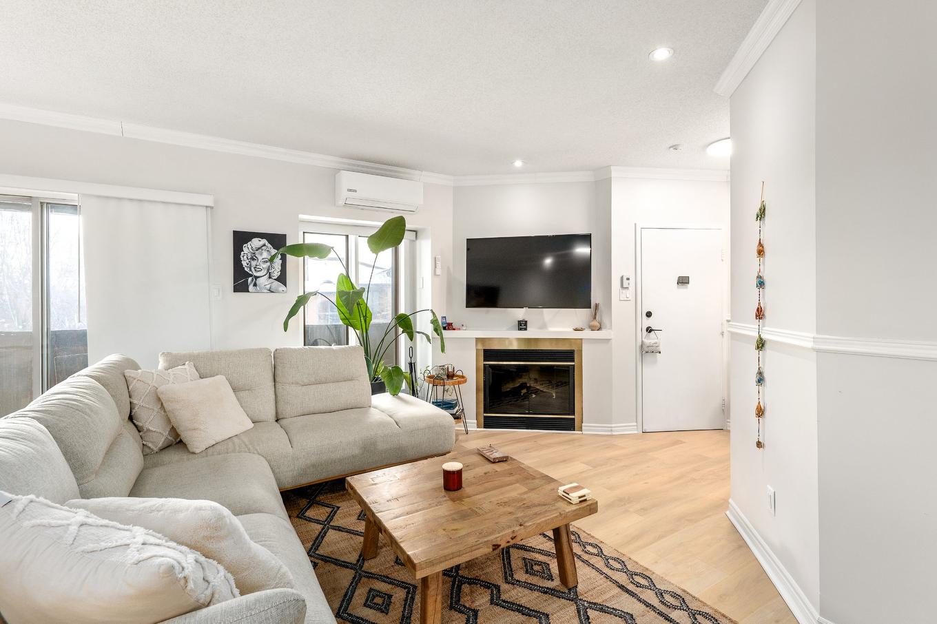 Living room - 55-435 Boul. Dagenais E., Laval (Vimont), QC - Indoor Photo Showing Living Room With Fireplace